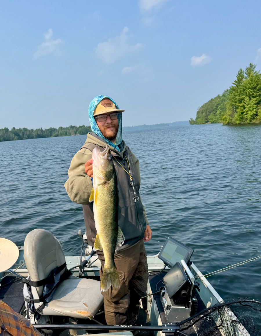 Guest holding a walleye caught trolling